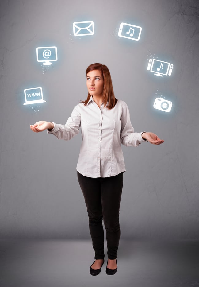 business woman standing and juggling with elecrtonic devices icons